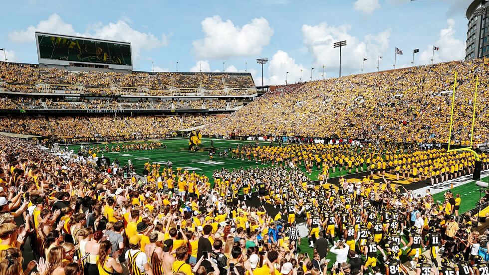 A picture from the Iowa Athletics Department shows the band performing ahead of the Iowa...