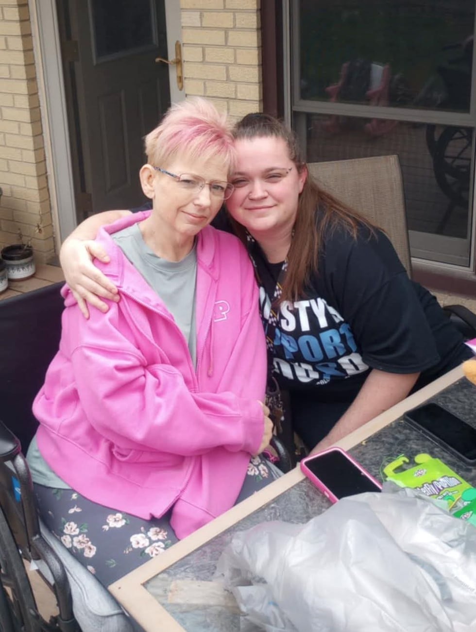 Christy Schroeder, 52, (left) poses for a photo alongside her daughter, 32-year-old Amanda...