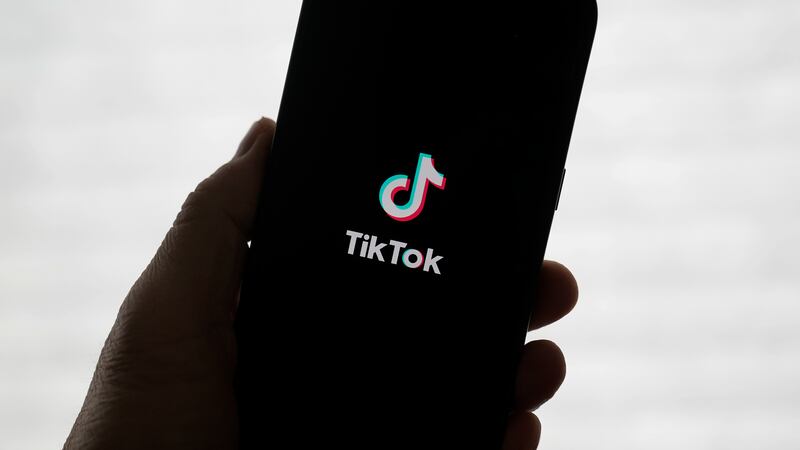 A TikTok logo is shown on a phone in San Francisco, Friday, Jan. 17, 2025. (AP Photo/Jeff Chiu)